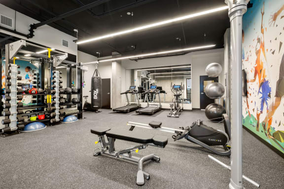 a large fitness room with weights and other exercise equipment at Ion Town Center, Shoreline, WA 98133