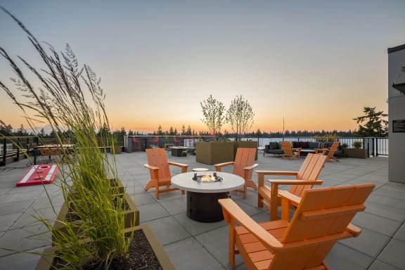 a patio with a firepit and chairs on a roof at Ion Town Center, Shoreline, 98133