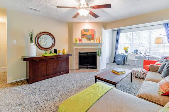 A living room with a fireplace and a couch.