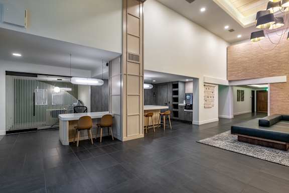 A modern kitchen with a dining table and chairs.