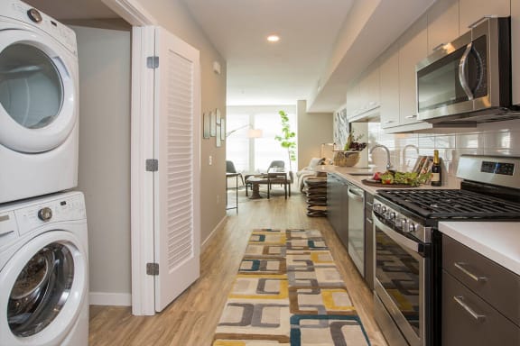 Kitchen With Washer Dryer at AV8, California, 92101