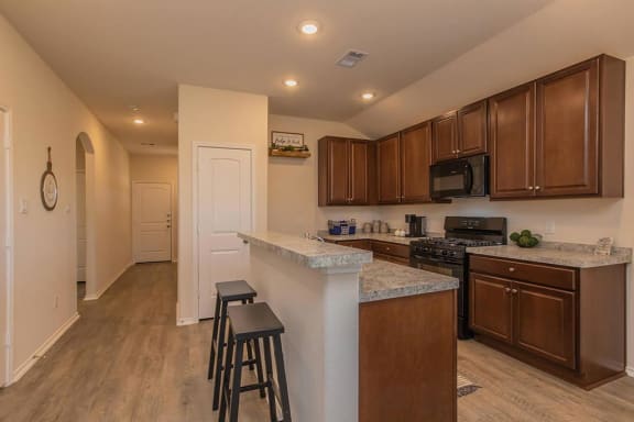 a kitchen with a counter top and a sink