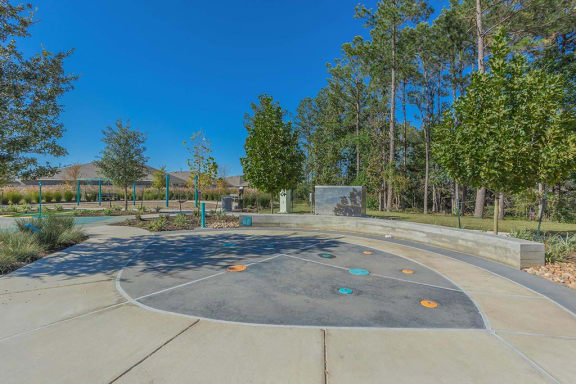 a park with a basketball court and trees
