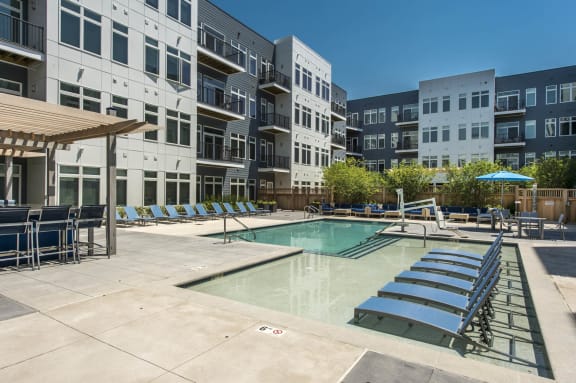 our apartments have a pool and lounge chairs