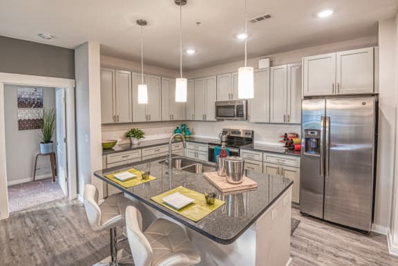 a kitchen with stainless steel appliances and a counter top