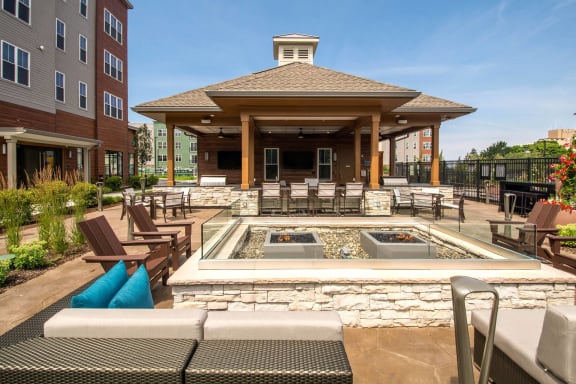 a covered patio with a pool and a pavilion