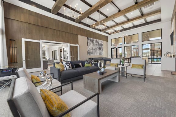a living room with couches and chairs and a table