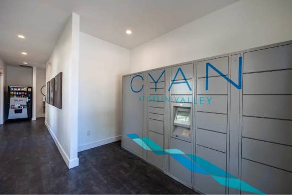 A wall with the word CYAN painted on it.