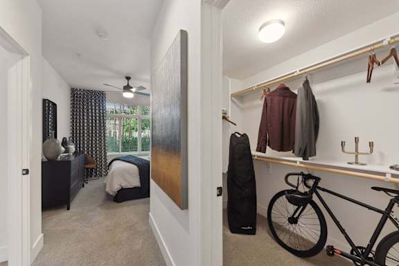A bedroom with a bicycle on the floor.