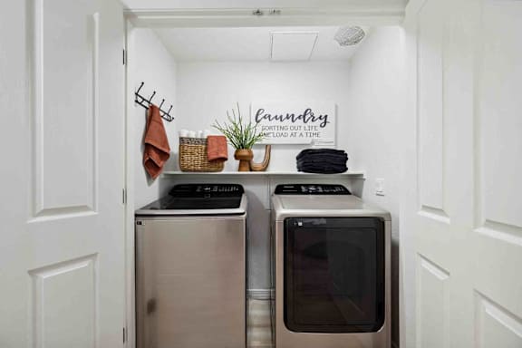 A laundry room with a washer and dryer.