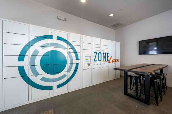 A room with a white wall and a logo on it.