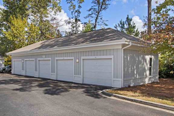 A two-car garage with a grey roof and white walls.
