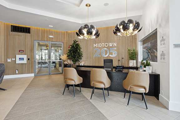 A reception area with a sign that says Midtown 205.