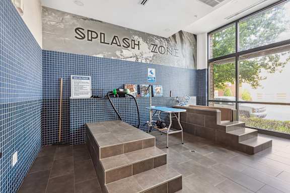 A room with a sign that says "SPLASH ZONE" on the wall.