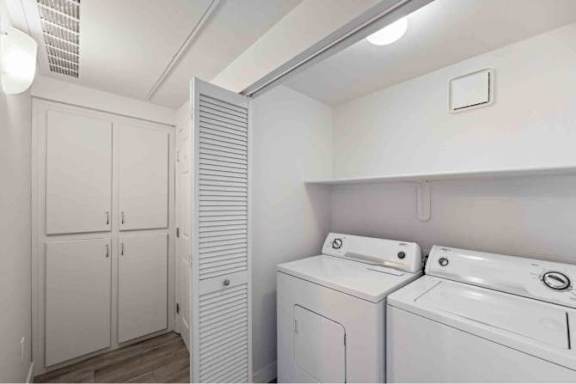 A laundry room with a washer and dryer.