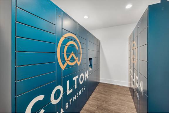 Colton apartments logo on a blue wall.