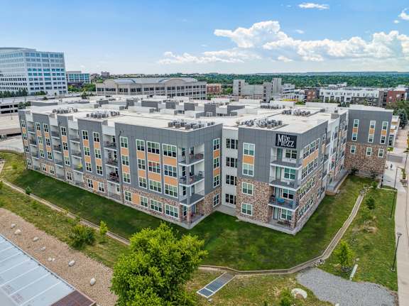 an aerial view of an apartment building in the city