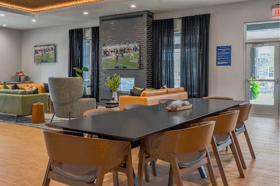A conference room with a long table and chairs.