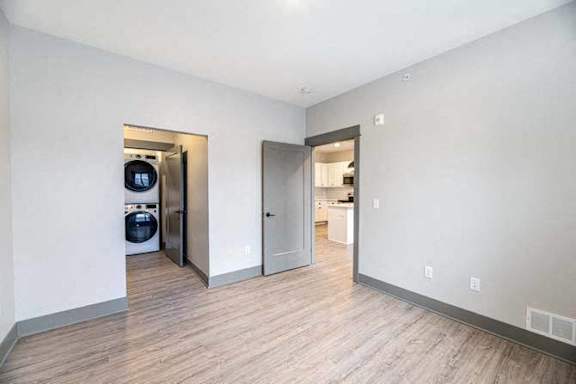 A room with a washer and dryer in it.