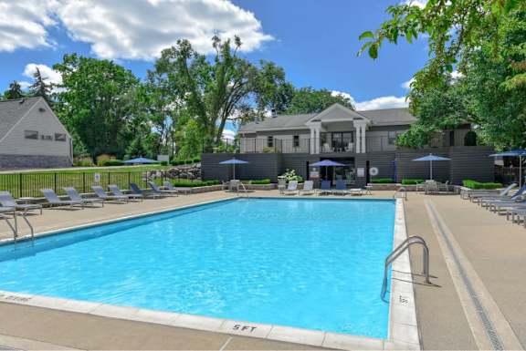 Pool with lounge chairs at The Villas at Northstar luxury apartments in Ann Arbor, MI
