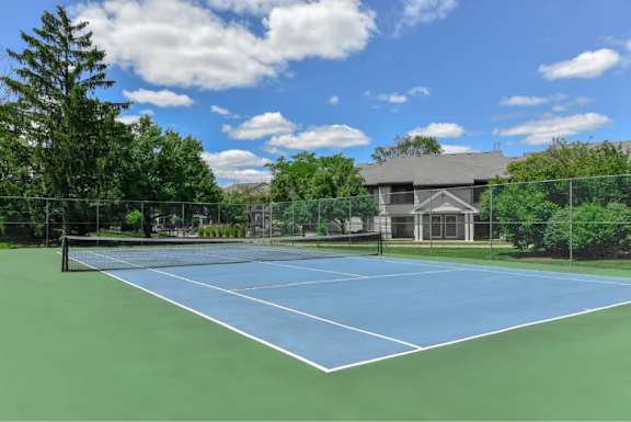 Fenced tennis court at The Villas at Northstar luxury apartments in Ann Arbor, MI
