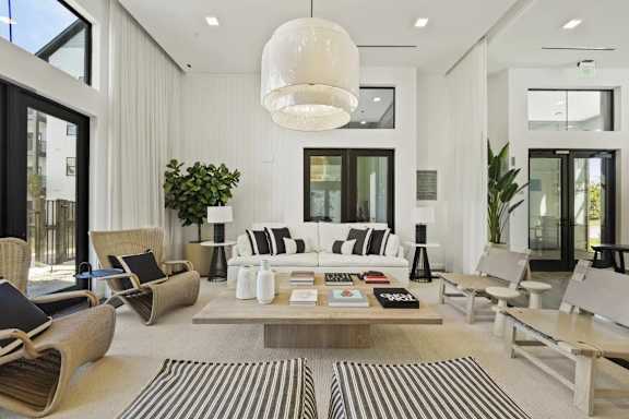 A modern living room with a large sofa set and a coffee table.