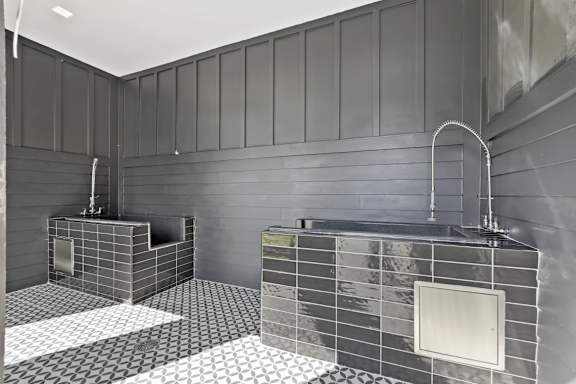 A bathroom with two sinks and a large mirror.