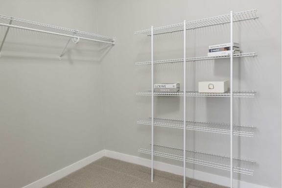 Empty shelves in a room with white walls.