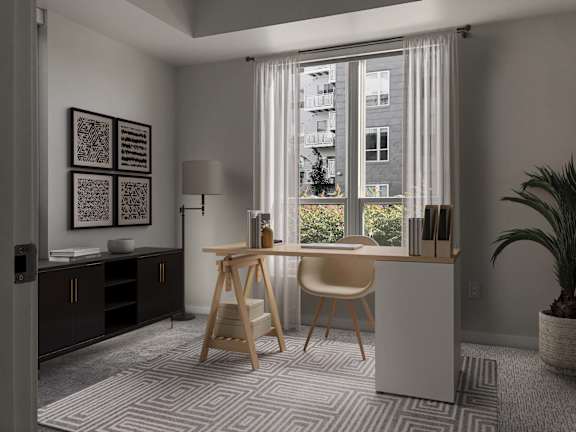 A room with a desk, chair, and a window with white curtains.