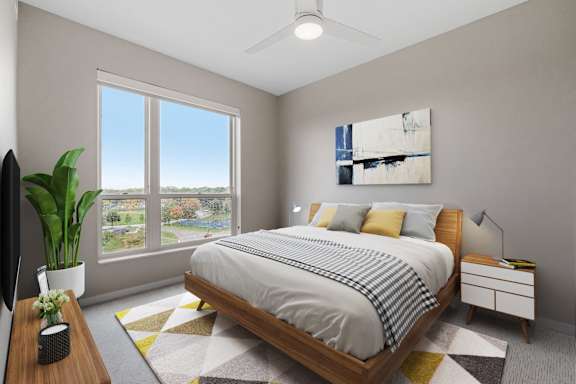 A bedroom with a large bed, a window with a view, and a painting on the wall.
