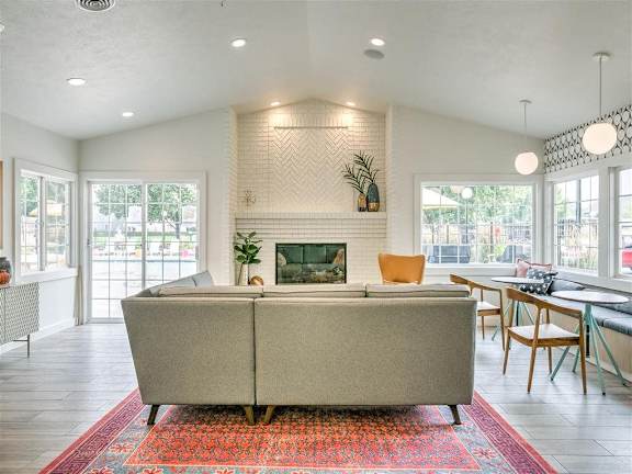 A living room with a fireplace and a couch.