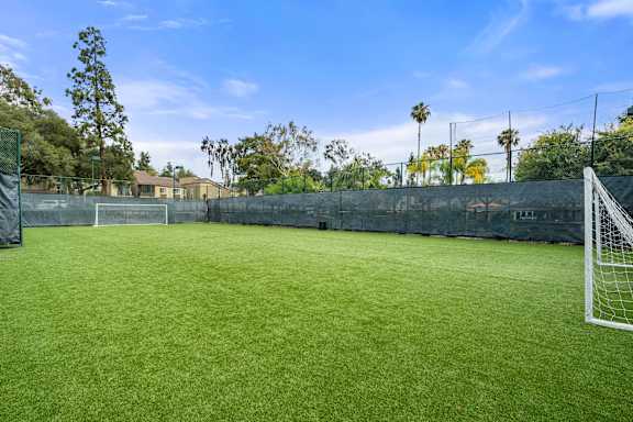 A soccer field with a goal post on the right side.