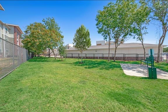 Pet park with green lawn at Alta Denton Station, Texas, 76208