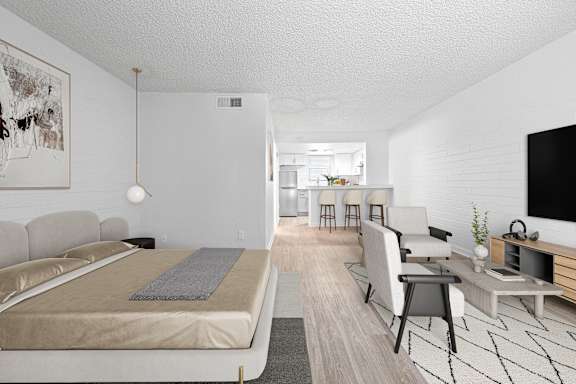A modern bedroom with a large bed and a television.