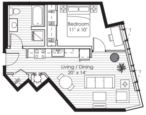 A floor plan of a small apartment with a bedroom and living/dining area.