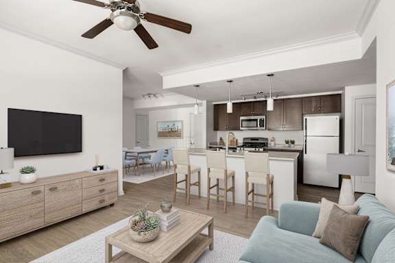 A modern living room with a blue couch and a wooden coffee table and stylish vinyl plank flooring.