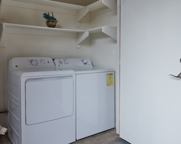 a washer and dryer in the laundry room of a home