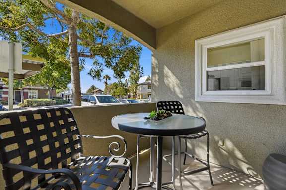 A patio with a table and chairs is shown.