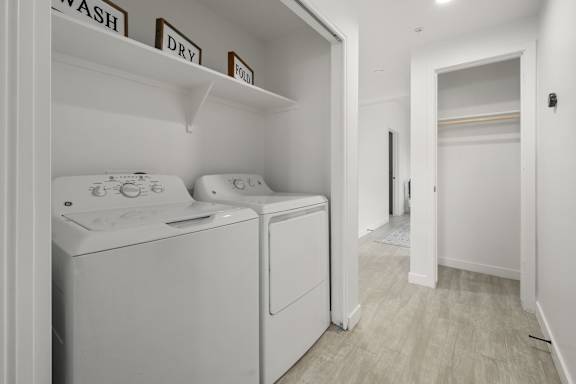 A laundry room with a washer and dryer.