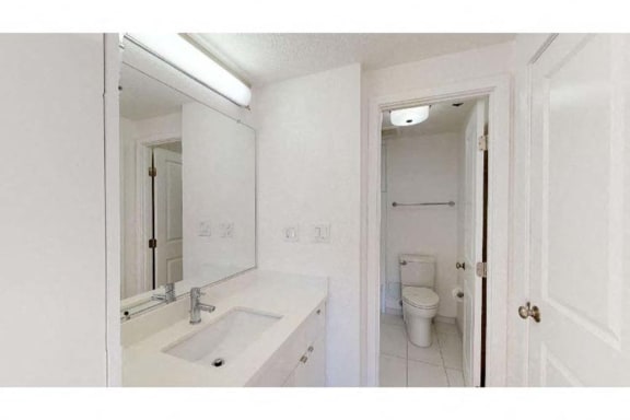 a bathroom with a sink and a toilet in it