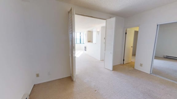 an empty room with a door that is open