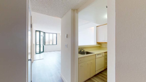 a kitchen with a sink and a window