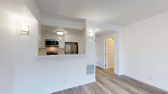 a kitchen with a stove top oven next to a microwave