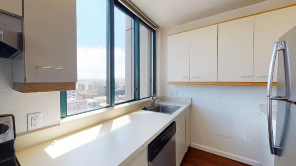 a kitchen with a large window and a sink