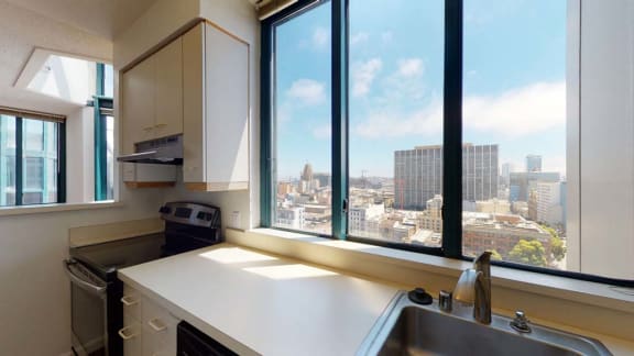 a kitchen with a sink and a window