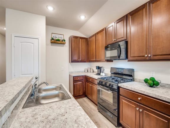 a kitchen with a sink and a stove