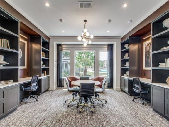 a conference room with a table and chairs and a large window