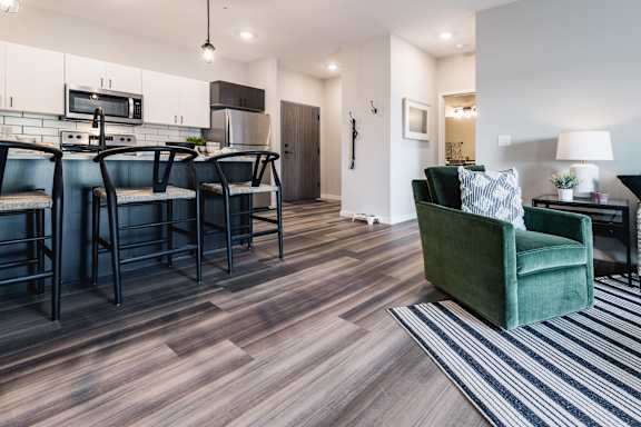 a living room with a kitchen and a dining room