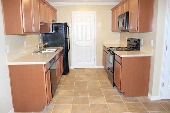Kitchen with refrigerator oven dishwasher at Aventine Forest Lake Oldsmar Tampa Florida