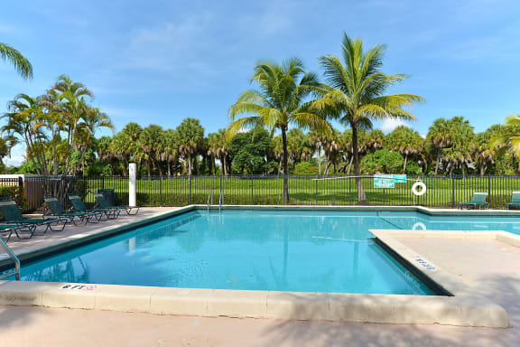Relaxing Chair Near Pool at St. Andrews Palm Beach Apartments, West Palm Beach